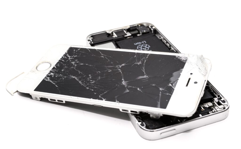 technology-telephone-mobile-smart-1388947-1388947 Close-up of a broken smartphone with a severely cracked screen.