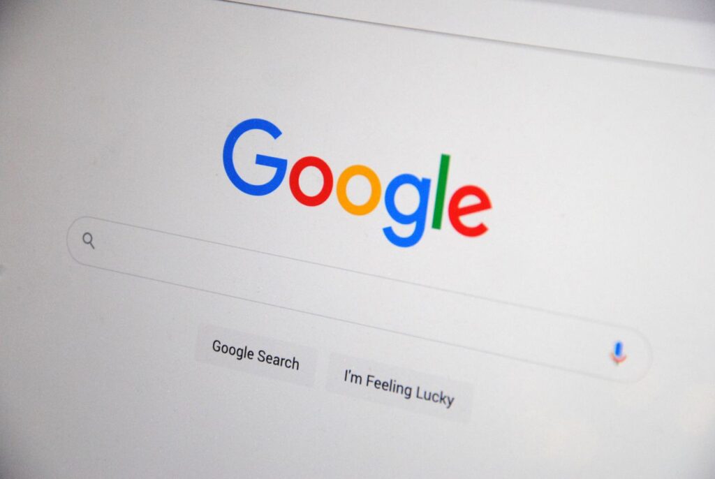 pexels-photo-13628541-13628541 Close-up of the Google homepage on a screen showing search options.