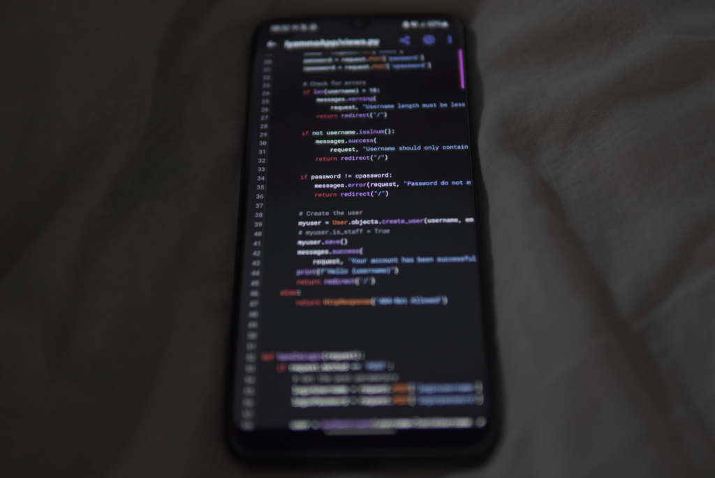 pexels-photo-20694602-20694602 Close-up of a smartphone showing Python code on the display, showcasing coding and technology.